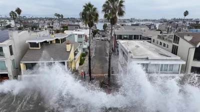 Waves hit a walkway in front of homes in Long Beach, Calif., Saturday, Oct. 10, 2026, as Tropical Storm Rachel approaches. (AP Photo/William Liang)