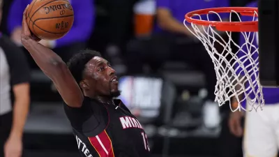 FILE - In this Oct. 11, 2020, file photo, Miami Heat's Bam Adebayo (13) dunks during the second half in Game 6 of basketball's NBA Finals against the Los Angeles Lakers in Lake Buena Vista, Fla. Adebayo and the Miami Heat are working on a contract extension, the team said Tuesday, Nov. 24, 2020, a deal that when finalized will likely guarantee him at least 8 million over the next six seasons and perhaps as much as 0 million in that span.(AP Photo/Mark J. Terrill, File)