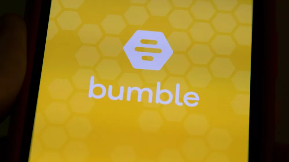 FILE PHOTO: The Bumble Inc. (BMBL) app is shown on an Apple iPhone in this photo illustration as the dating app operator made its debut IPO on the Nasdaq stock exchange February 11, 2021.    REUTERS/Mike Blake/Illustration/File Photo