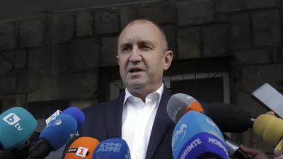 Bulgarian President Rumen Radev speaks to journalists after casting his vote in Sofia, Sunday, Nov. 21, 2021. Bulgarians are at the polls to choose a new president in a hotly contested runoff amid a COVID-19 surge and a political crisis that has gripped the European Unionâ€™s poorest country. The choice is between incumbent Rumen Radev and Sofia University rector Anastas Gerdzhikov. (AP Photo/Valentina Petrova)