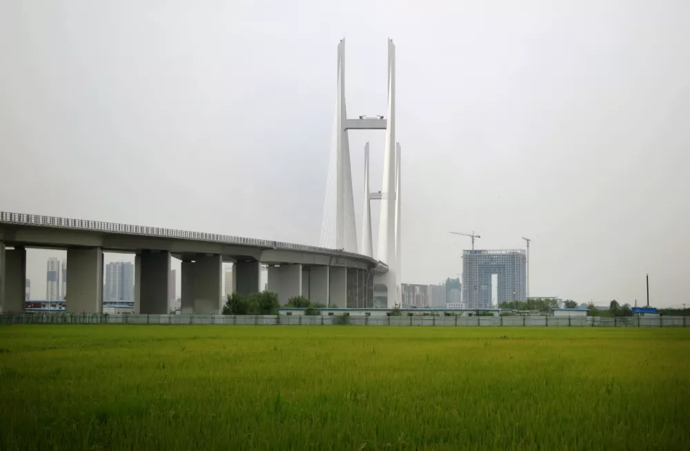 A new bridge connecting North Korea and China, seen from the North Korean side of the Yalu River border, on Sept. 2, 2014, where it touches down in rice fields in Sinuiju, North Korea. (AP Photo,File)