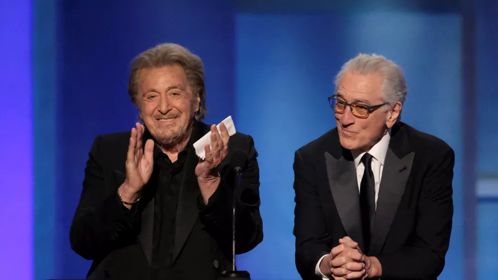 FILE PHOTO: Al Pacino and Robert De Niro react onstage during the 50th AFI Life Achievement Award at Dolby Theatre in Los Angeles, California, U.S., April 26, 2025. REUTERS/Mario Anzuoni/File Photo