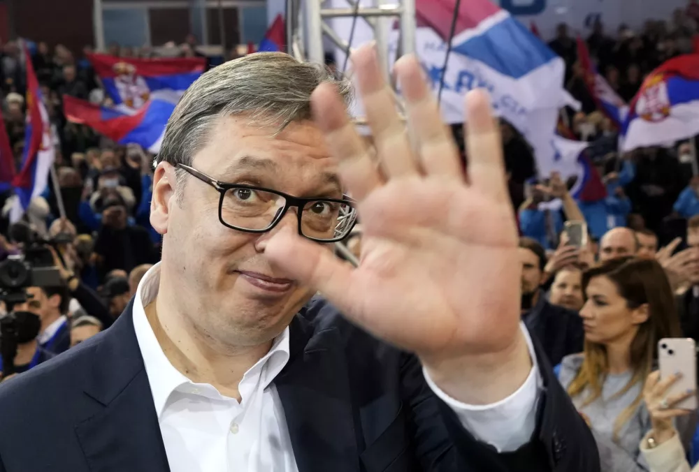 Current Serbian President Aleksandar Vucic waves to his supporters during a pre-election rally, in Belgrade, Serbia, Thursday, March 31, 2022. Polls predict that Vucic, who has been boasting his personal ties to Russian President Vladimir Putin, will win another five-year term as president. His his right-wing Serbian Progressive Party is projected to continue to dominate the parliament. But polls also predict a close race in the capital, Belgrade, that could undermine his increasingly autocratic rule. (AP Photo/Darko Vojinovic)