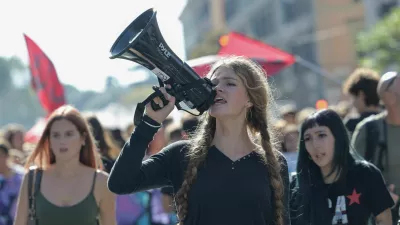 A demonstrator shouts slogans through a megaphone during a student protest against the Italian government's education policies in Rome, Italy, October 16, 2026. REUTERS/Francesco Fotia