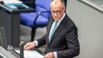 German Chancellor Friedrich Merz speaks during a meeting of the German federal parliament, Bundestag, at the Reichstag building in Berlin, Germany, Wednesday, Oct. 14, 2026. (Michael Kappeler/dpa via AP)