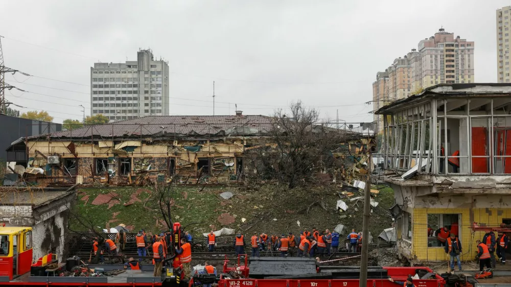 Employees repair railway tracks and remove debris at a metro station which was hit by an overnight Russian missile strike, amid Russia's attack on Ukraine, in Kyiv, Ukraine October 19, 2026. REUTERS/Valentyn Ogirenko
