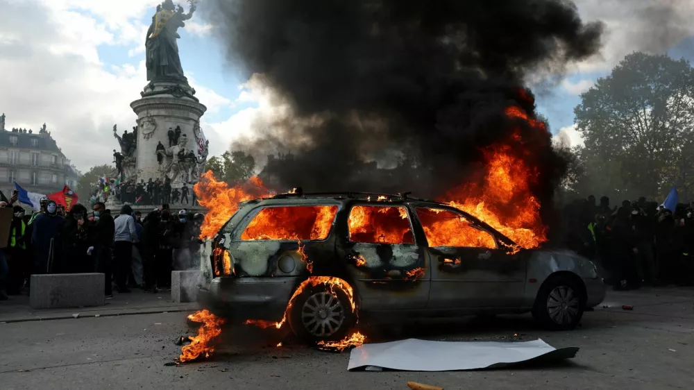 A car burns amid clashes between protesters and the French police during a demonstration against the cost of living and rising fuel prices at the Place de la Republique in Paris as part of nationwide protests called by the "Yellow Vests" movement, joined by French high school and university students, teachers and parents demanding better school conditions and government action, as well as labour unions, workers, farmers and retirees, France, October 17, 2026. REUTERS/Stephanie Lecocq&nbsp;   TPX IMAGES OF THE DAY