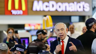 Israeli Prime Minister Benjamin Netanyahu speaks near a McDonald's as he meets members of the public at a mall, ahead of Israel's national election, in Ramla, Israel October 19, 2026. REUTERS/Amir Cohen