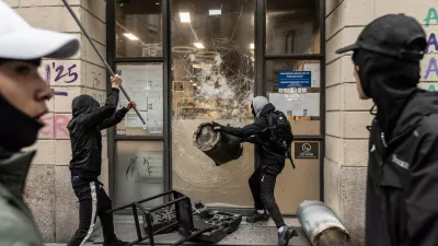 MILAN, ITALY - OCTOBER 18: Protesters vandalize a shop during protests in Milan, Italy, on October 18, 2026. Groups threw stones, bottles, firecrackers and barriers at police officers, who responded with tear gas and water cannon, while shops were damaged and looted around the city center and a Carabinieri vehicle was destroyed. Andrea Carrubba / AnadoluNo Use USA No use UK No use Canada No use France No use Japan No use Italy No use Australia No use Spain No use Belgium No use Korea No use South Africa No use Hong Kong No use New Zealand No use Turkey