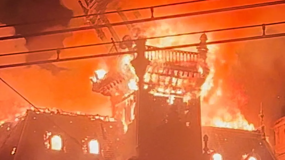 Fire in Limoges city hall amid protests, in Limoges, France, October 17, 2026, in this screengrab from a video obtained from social media. Lucas Destrem/via REUTERS THIS IMAGE HAS BEEN SUPPLIED BY A THIRD PARTY. MANDATORY CREDIT. NO RESALES. NO ARCHIVES. THIS IMAGE WAS PROCESSED BY REUTERS TO ENHANCE QUALITY, AN UNPROCESSED VERSION HAS BEEN PROVIDED SEPARATELY. TPX IMAGES OF THE DAY    VERIFICATION Reuters verified the location of the video from original file metadata and building structure that matched archive and satellite imagery of the area. The date matched Reuters reporting of a fire in Limoges city hall on October 17.