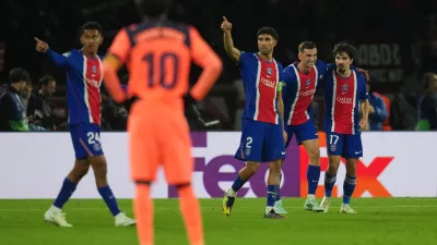 PSG's Fabian Ruiz, second right, celebrates after scoring his side's fourth goal during the Champions League opening phase soccer match between Paris Saint-Germain and FC Barcelona in Paris, Tuesday, Oct. 20, 2026. (AP Photo/Thibault Camus)