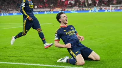 Arsenal's Declan Rice celebrates after scoring his side's second goal during the UEFA Champions League soccer match between Bayern Munich and Arsenal in Munich Germany, Wednesday, Oct. 21, 2026. (AP Photo/Martin Meissner)