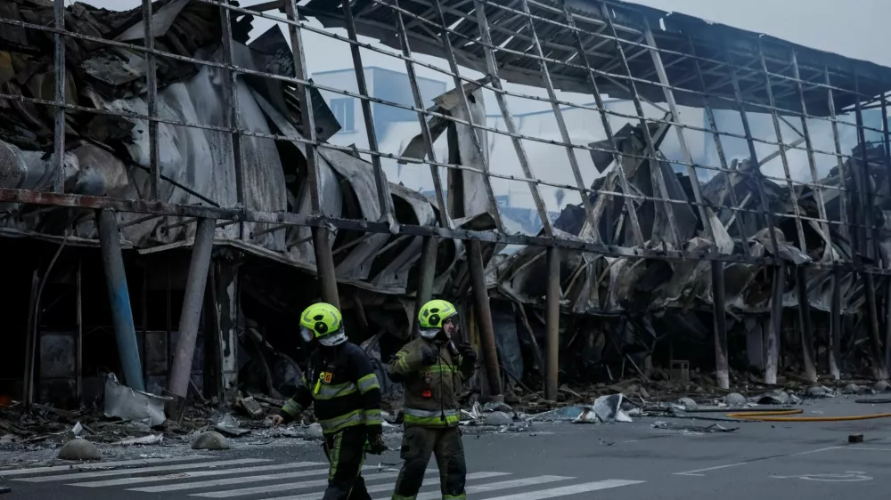 Rescuers work at the site of a shopping centre hit by a Russian missile attack, amid Russia's attack on Ukraine, in Kyiv, Ukraine October 22, 2026. REUTERS/Gleb Garanich