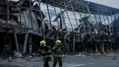 Rescuers work at the site of a shopping centre hit by a Russian missile attack, amid Russia's attack on Ukraine, in Kyiv, Ukraine October 22, 2026. REUTERS/Gleb Garanich