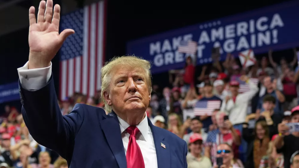 President Donald Trump waves at a campaign rally at Alico Arena on the campus of Florida Gulf Coast University, Friday, Oct. 23, 2026, in Fort Myers, Fla. (AP Photo/Mark Schiefelbein)