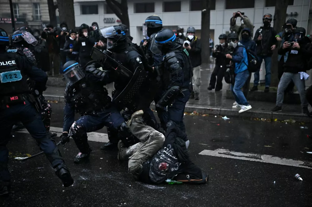 French riot police apprehend a protester during an authorised demonstration organised by labour unions in Paris as part of nationwide protests called by the "Yellow Vests" movement joined by French high school and university students against the cost of living and rising fuel prices, in France, October 24, 2026. REUTERS/Dylan Martinez