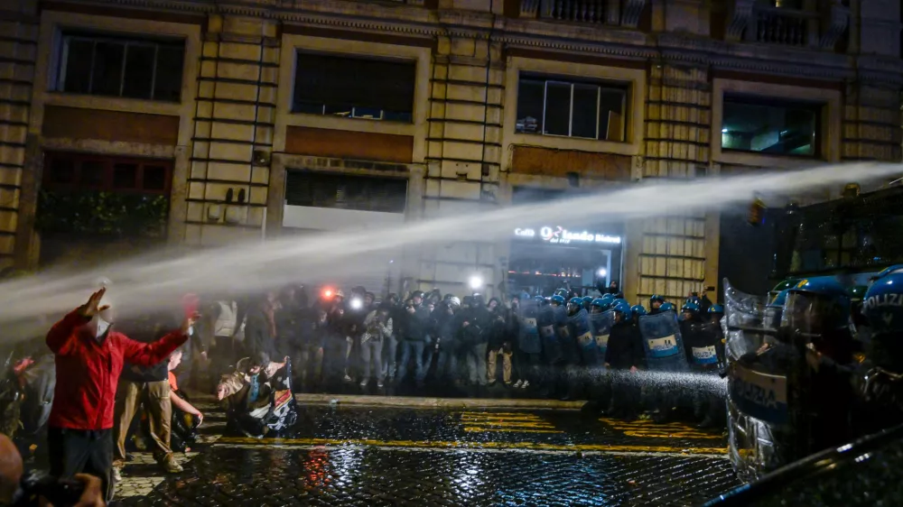 Police spray water during a protest in Rome, Italy, Saturday, Oct. 24, 2026. (Valentina Stefanelli/LaPresse via AP)