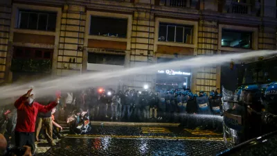 Police spray water during a protest in Rome, Italy, Saturday, Oct. 24, 2026. (Valentina Stefanelli/LaPresse via AP)
