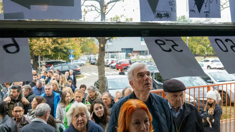 People queue outside a polling station to vote during the parliamentary election in Novi Sad, Serbia, October 25, 2026. REUTERS/Uros Arsic
