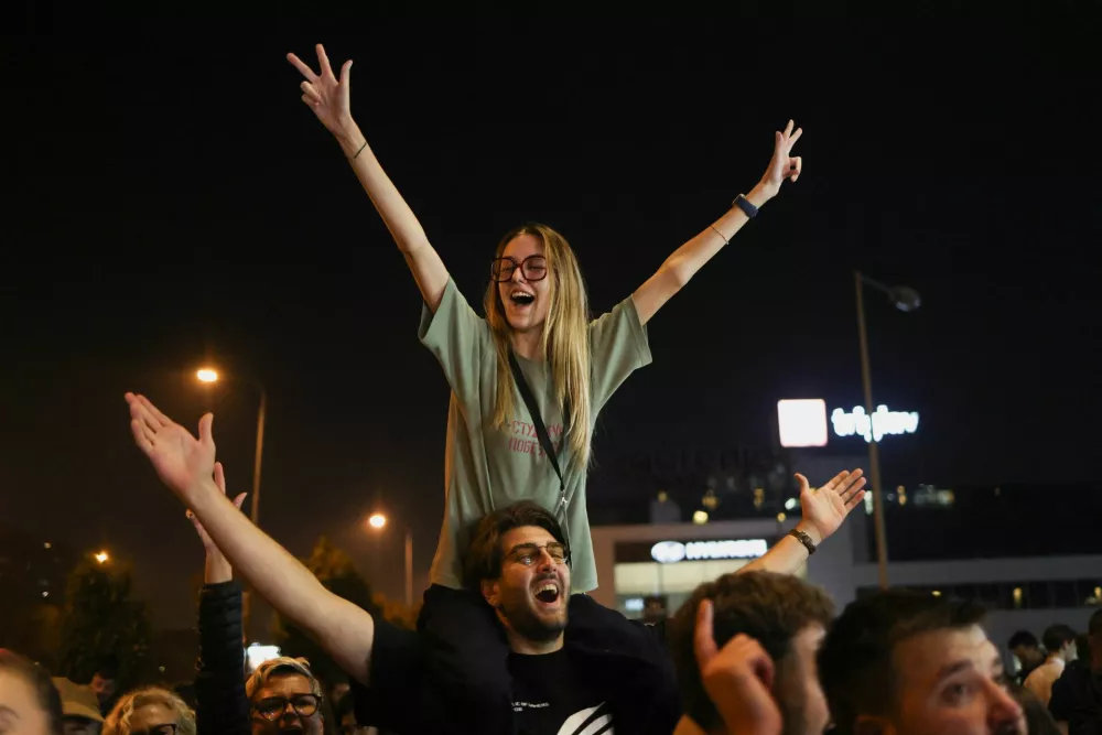 Supporters of the electoral list "Student List - Students Win" celebrate following the first results of the parliamentary election in Belgrade, Serbia, October 25, 2026. REUTERS/Marko Djurica