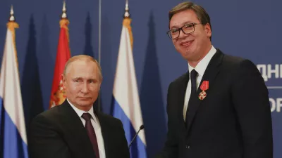 FILE - Russian President Vladimir Putin, left, shakes hands with Serbian President Aleksandar Vucic after being awarded the Order of Alexander Nevsky in Belgrade, Serbia, Thursday, Jan. 17, 2019. (AP Photo/Darko Vojinovic, File)