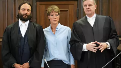 German entrepreneur and gastronome Christina Block and her lawyers Otmar Kury and Ingo Bott wait for the start of her trial at the regional court in Hamburg, Germany, July 11, 2025. Marcus Brandt/Pool via REUTERS