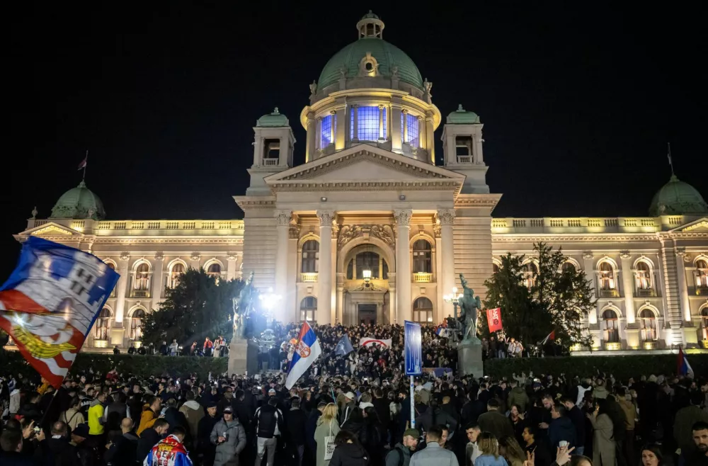 Supporters of the electoral list "Student List - Students Win" celebrate at the Parliament building after Aleksandar Vucic, Serbian Progressive Party (SNS) prime ministerial candidate, conceded defeat in the parliamentary election in Belgrade, Serbia, October 26, 2026. REUTERS/Marko Djurica