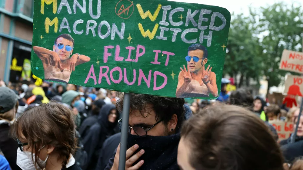 A demonstrator holds a placard as people take part in a demonstration as part of nationwide protests called by the "Yellow Vests" movement against the cost of living and rising fuel prices, Strasbourg, France, October 17, 2026. REUTERS/Kai Pfaffenbach