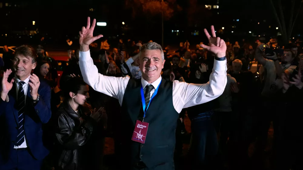 Students' List leader Ilija Srdanovic celebrates after Aleksandar Vucic, leader of the right-wing Serbian Progressive Party (SNS) conceded defeat in the parliamentary election in Belgrade, Serbia, Sunday, Oct. 25, 2026. (AP Photo/Petr David Josek)
