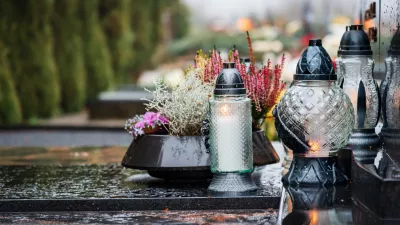 All Saints' Day and burning candles and flowers on the graves.Candles on graves symbolize the memory of the dead on November 1.Catholic cemetery during All Saints' Day.Selective focus.