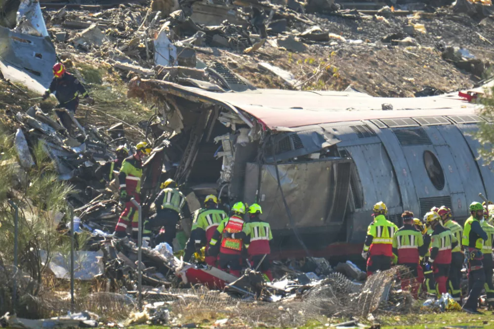 Emergency services work at the scene of a collision between two trains in Urda, Spain, Wednesday, Oct. 28, 2026. (AP Photo/Manu Fernandez)
