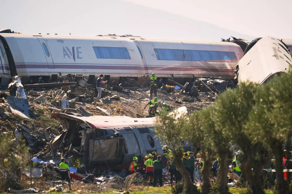 Emergency services attend to the victims at the scene of a collision between two trains in Urda, Spain, on Wednesday, Oct. 28, 2026. (AP Photo/Manu Fernandez)