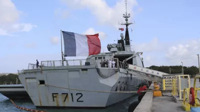 FILE - In this May 11 2017 file photo, the French stealth frigate Courbet is docked at Naval Base Guam, near Hagatna, Guam. rance is suspending its involvement in a NATO naval operation of Libya's coast after a standoff with a Turkish ship and amid growing tensions within the military alliance over Libya. France is also calling for crisis mechanism to prevent a repeat of an incident earlier this month between Turkish warships and the French naval vessel Courbet in the Mediterranean. (AP Photo/Haven Daley)