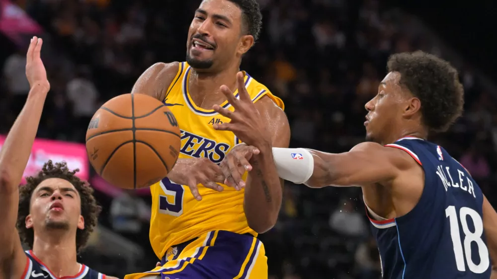Oct 28, 2026; Inglewood, California, USA; Los Angeles Lakers guard Quentin Grimes (5) is fouled by Los Angeles Clippers forward Baba Miller (18) in the second half at Intuit Dome. Mandatory Credit: Jayne Kamin-Oncea-Imagn Images