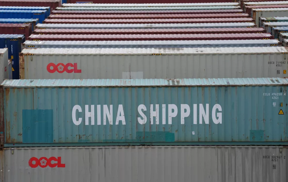 FILED - 09 July 2025, Hamburg: A container from China Shipping Container Lines (CSCL) stands among countless other containers at the Tollerort container terminal in the port of Hamburg. European Union firms are increasingly looking for new suppliers outside China to mitigate the effects of export restrictions imposed by Beijing, according to a survey released on Monday. Photo: Marcus Brandt/dpa