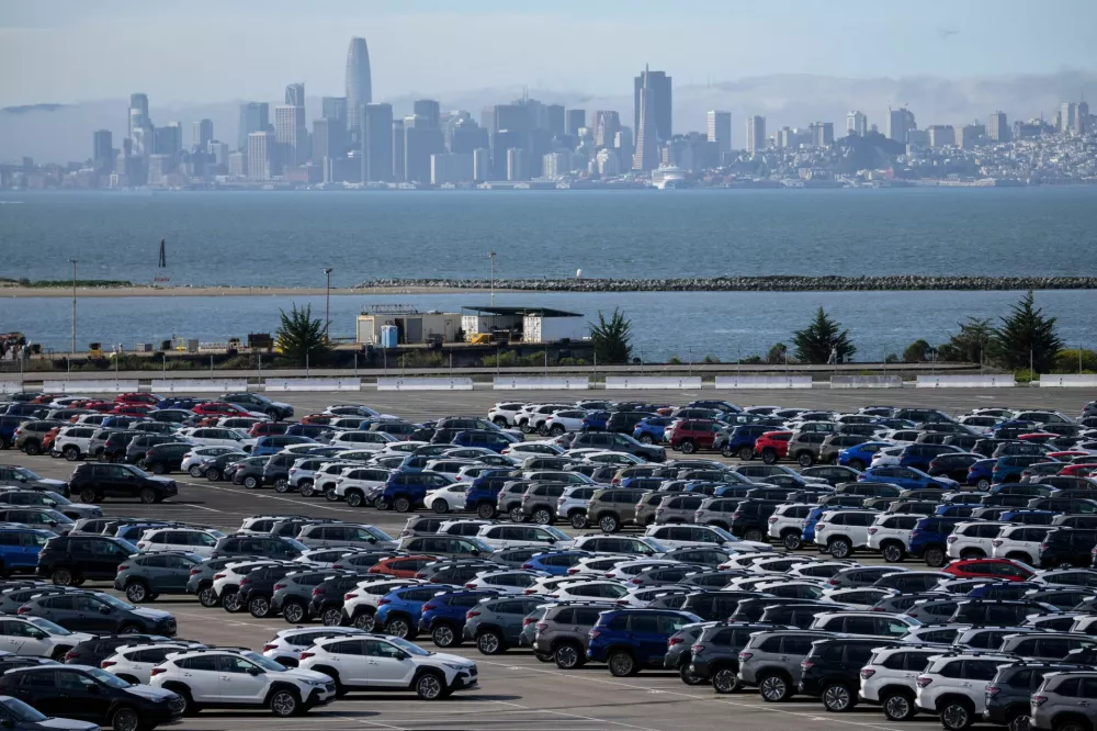 FILE PHOTO: New vehicles are seen at a parking lot in the Port of Richmond, as trade tensions escalate over U.S. tariffs with China, at the bay of San Francisco, California, U.S., April 11, 2025. REUTERS/Carlos Barria/File Photo
