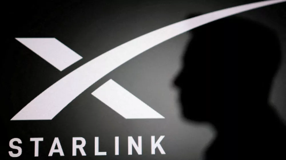 FILE PHOTO: The silhouette of Elon Musk and Starlink logo are seen in this illustration taken June 11, 2026. REUTERS/Dado Ruvic/Illustration/File Photo