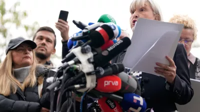 Mirjana Nikolic, right, rector of the University of Arts, speaks during a news conference by Serbia's student movement demanding the resignations of top police and security officials in Belgrade, Serbia, Thursday, Oct. 29, 2026. (AP Photo/Darko Vojinovic)