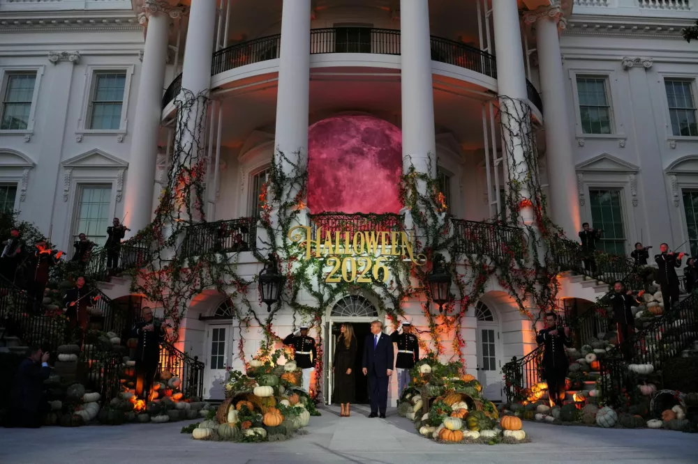 US President Donald Trump and first lady Melania Trump listen to a band play as they host a Halloween event at the White House in Washington, DC, US, October 29, 2026. REUTERS/Eric Lee