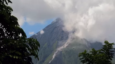 Mayon Volcano spews white smoke as seen from Daraga, Albay province, central Philippines on Thursday June 8, 2023. The Philippine Institute of Volcanology and Seismology raised Thursday the status of Mayon Volcano in Albay to Alert Level 3 due to "increased tendency towards a hazardous eruption." (AP Photo/John Michael Magdasoc)