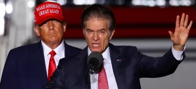 FILE PHOTO: Former U.S. President Donald Trump looks on as Pennsylvania Republican U.S. Senate candidate Dr. Mehmet Oz speaks at a pre-election rally to support Republican candidates in Latrobe, Pennsylvania, U.S., November 5, 2022. REUTERS/Mike Segar/File Photo